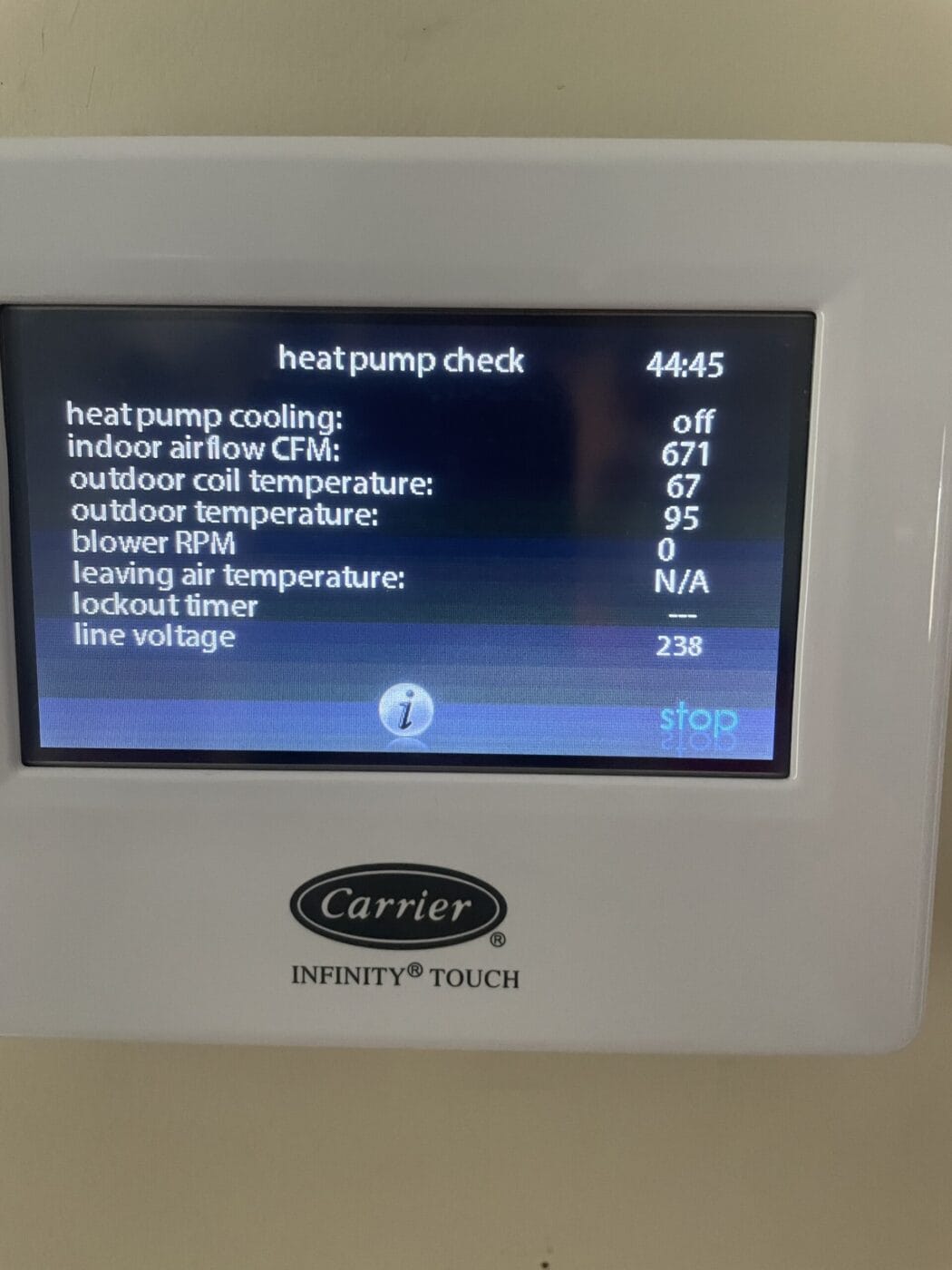 Thermostat displaying heat pump status: cooling off, indoor air flow 671 CFM, outdoor coil 67°F, outdoor temp 95°F, blower RPM 0, leaving air temp N/A, lockout time 0, line voltage 238.